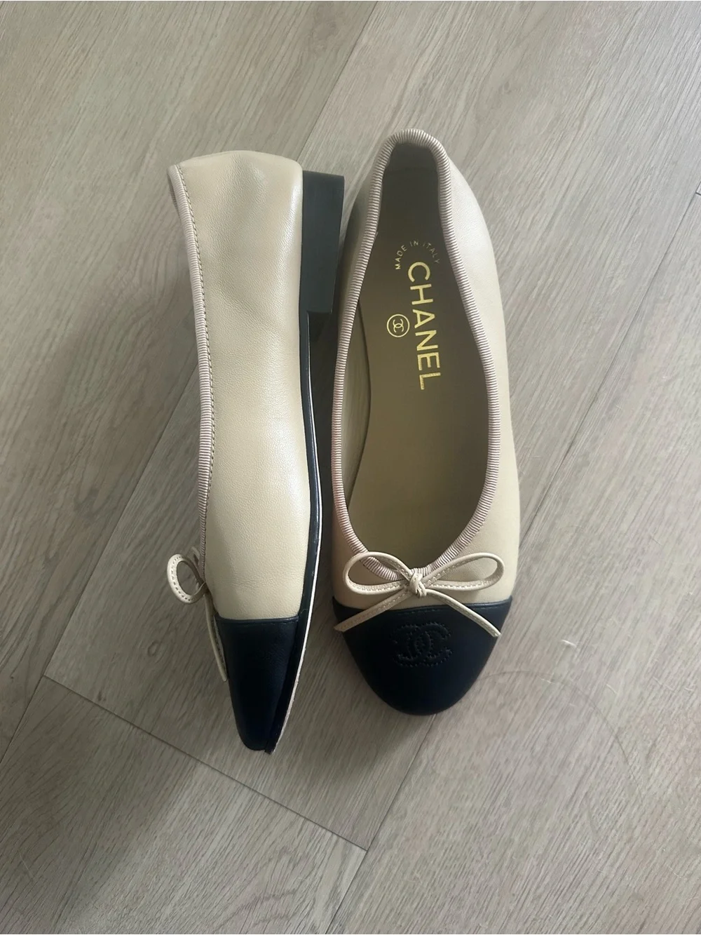 CHANEL Beige Leather Ballet Flats with Black Cap Toe